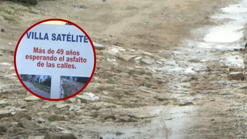 Moradores de 14 barrios en SDN exigen asfaltado; calles en mal estado por 50 años