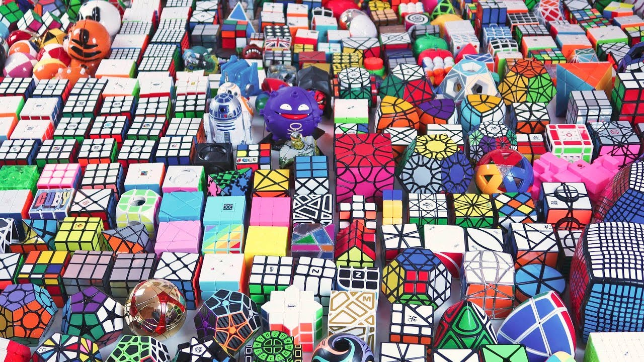 Colección variada de cubos de Rubik y rompecabezas